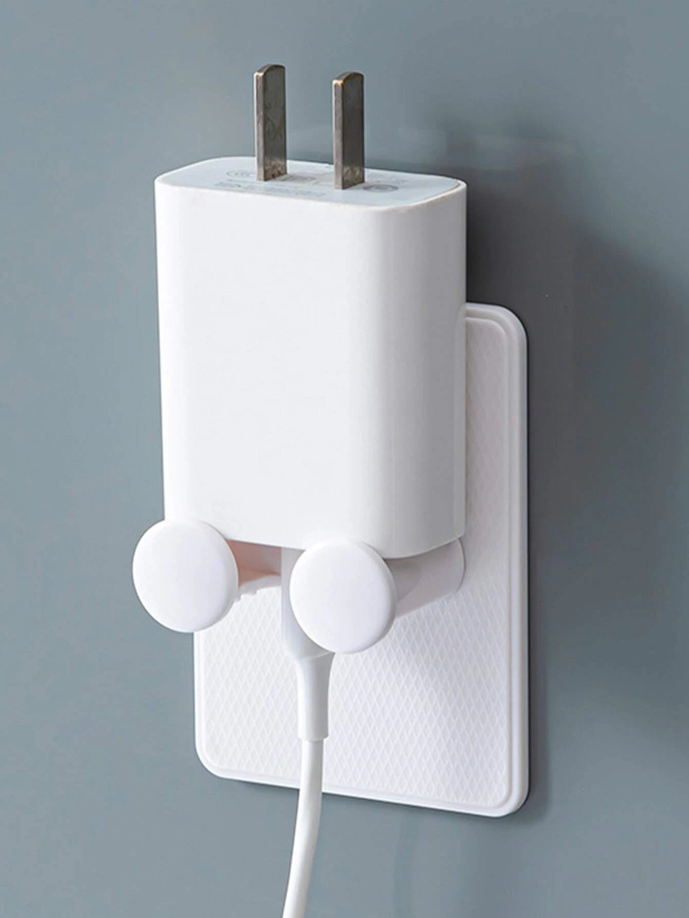 Līmējams lādētāja turētājs pie sienas