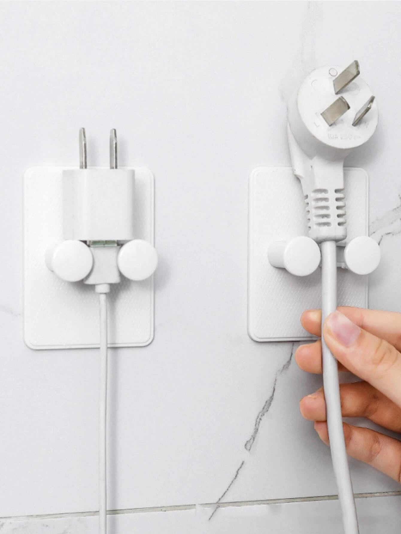 Līmējams lādētāja turētājs pie sienas