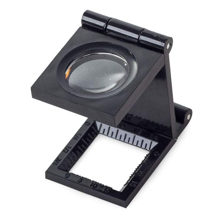 Palielināmais stikls - juveliera lupa uz statīva