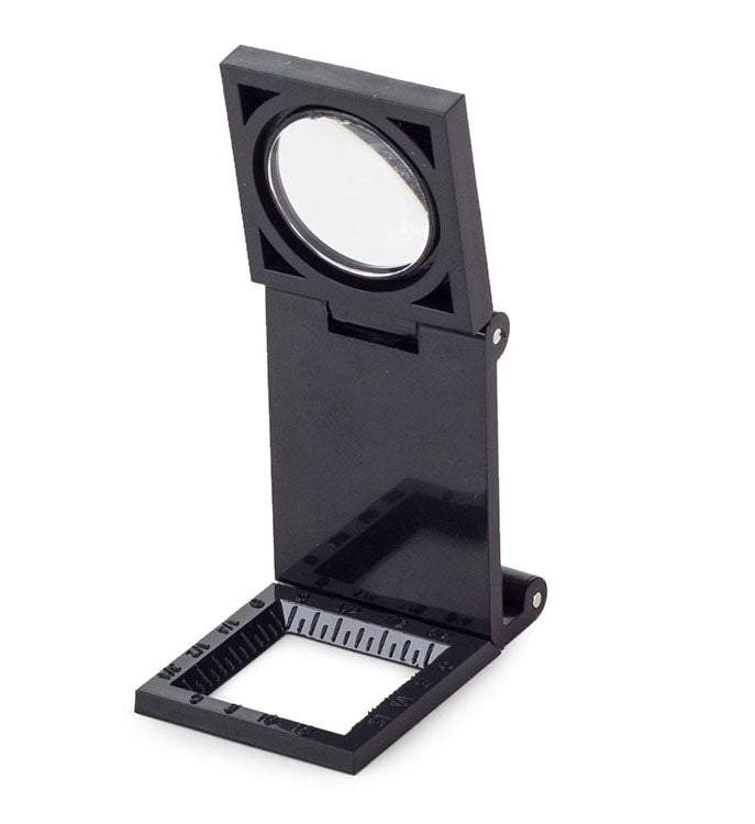 Palielināmais stikls - juveliera lupa uz statīva