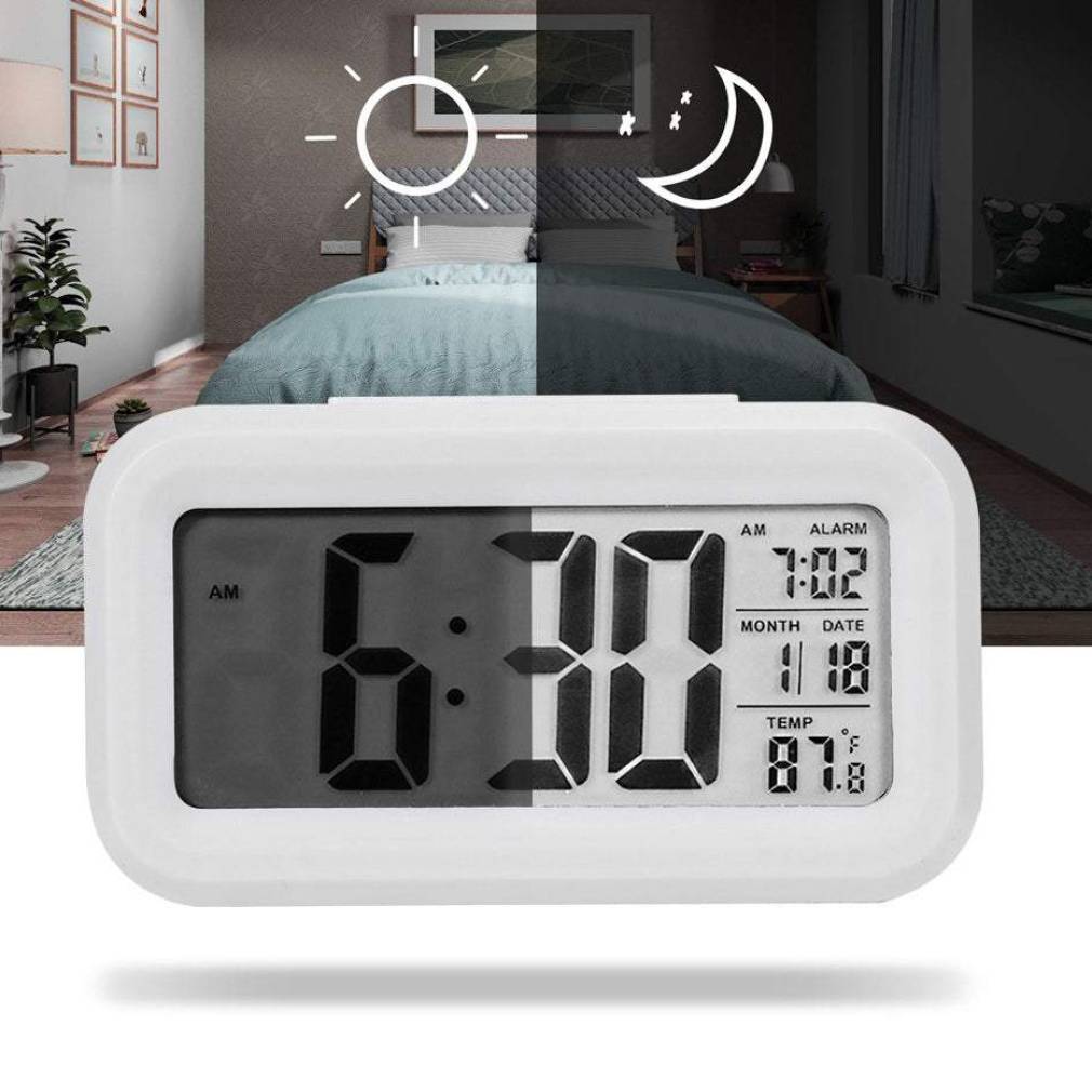 Elektroniskais modinātājs ar fona apgaismojumu