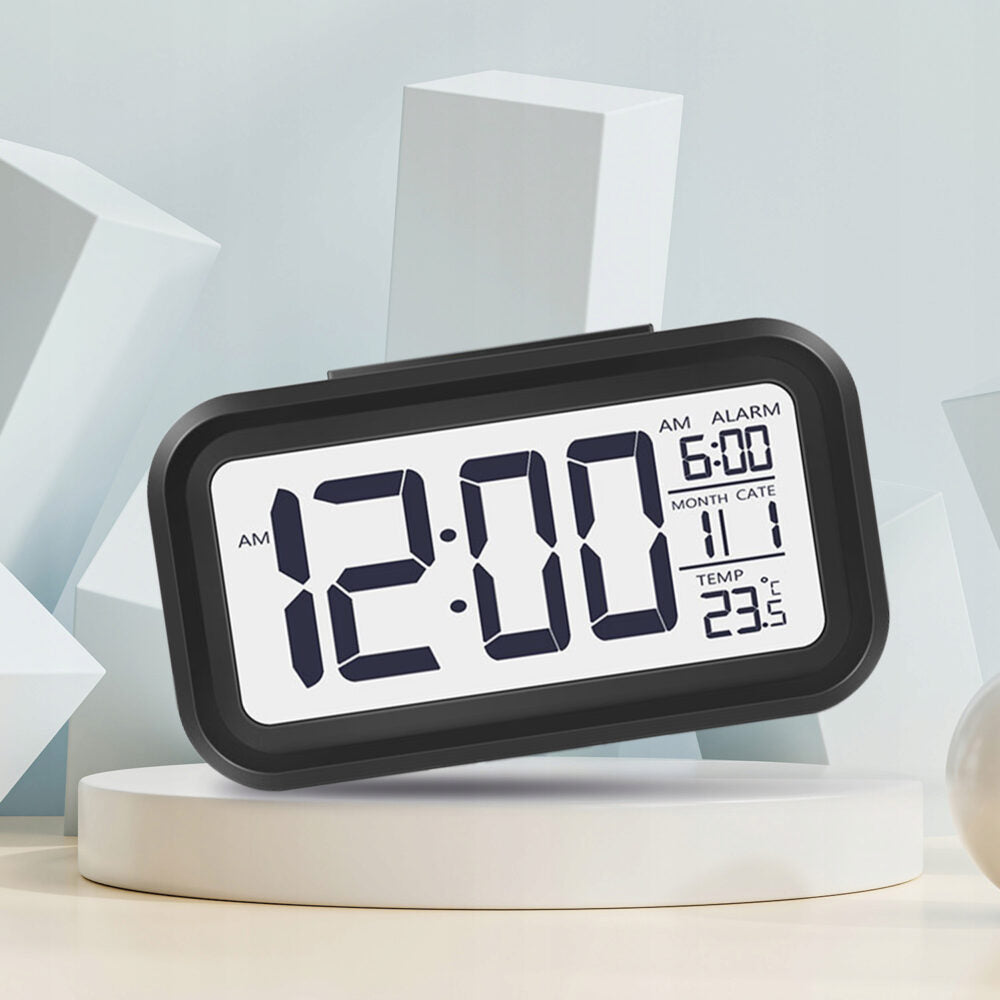 Elektroniskais modinātājs ar fona apgaismojumu