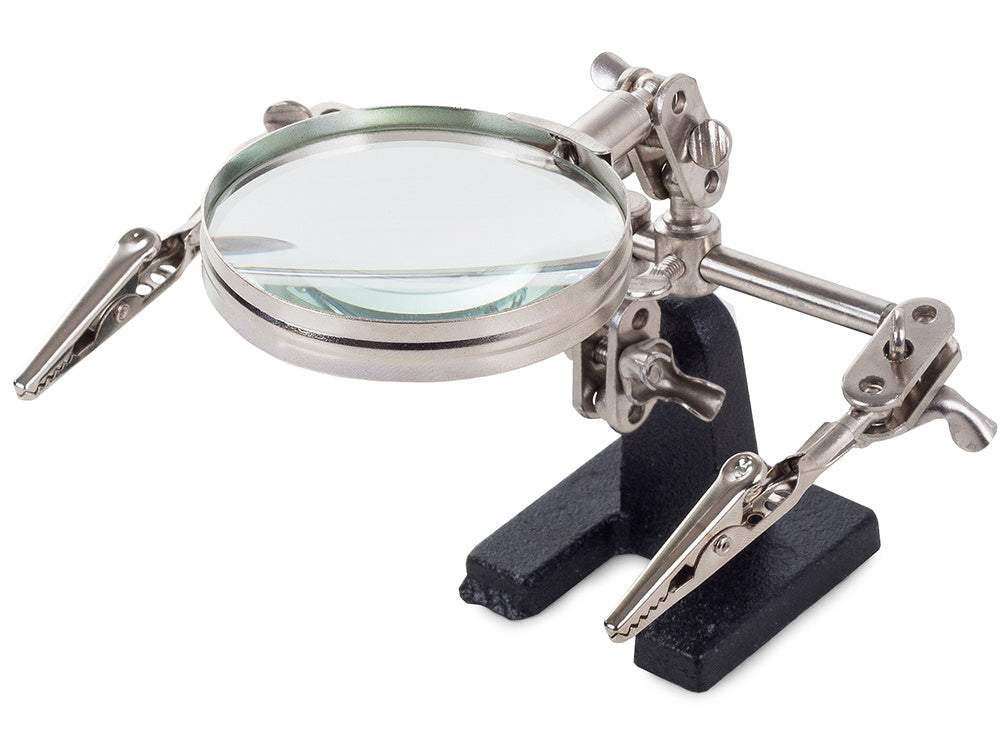 Palielināmais stikls ar turētājiem