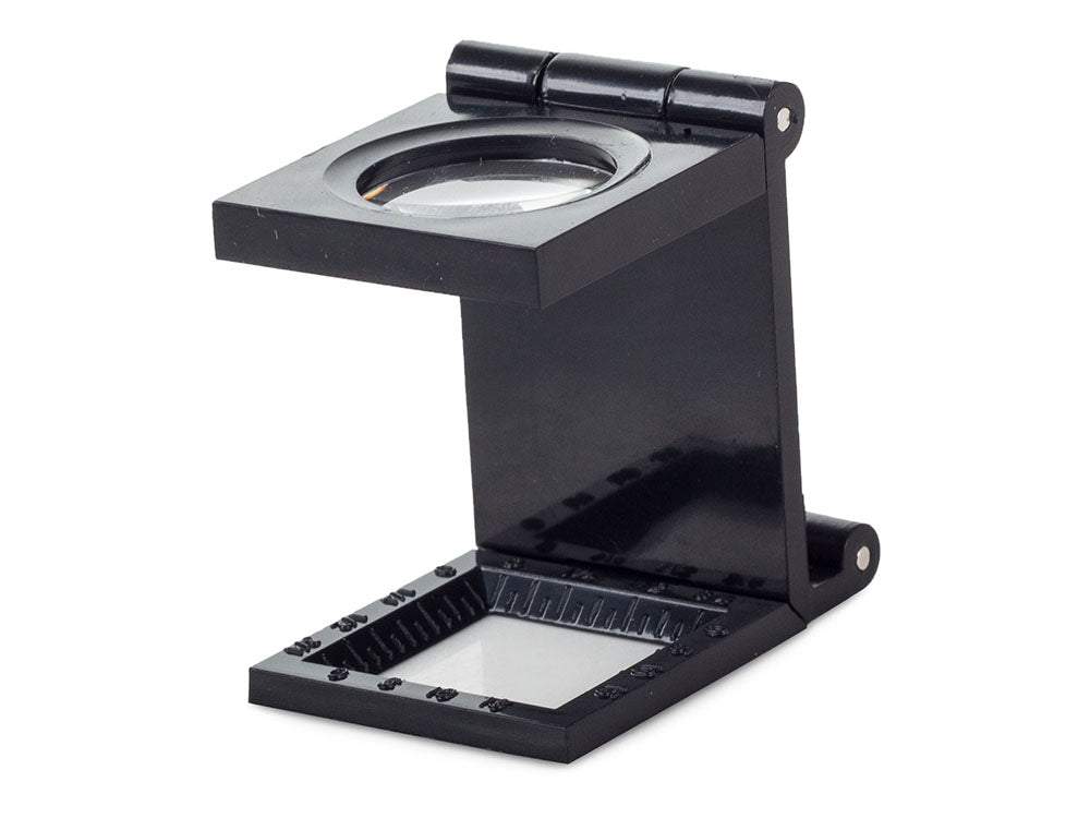 Palielināmais stikls - juveliera lupa uz statīva